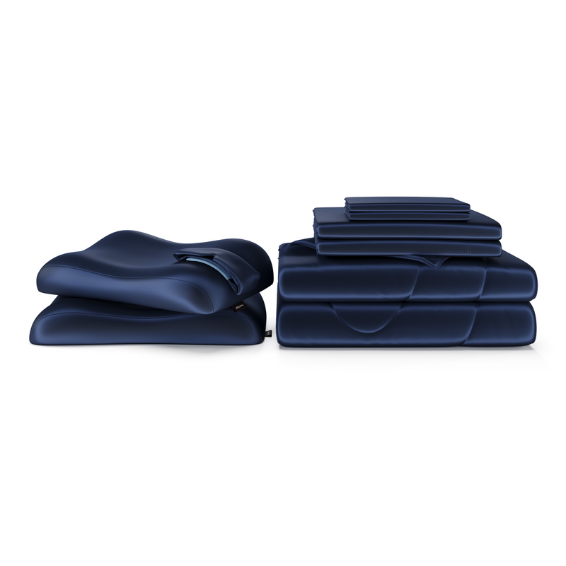 A coordinated set of navy blue pillows and bedding